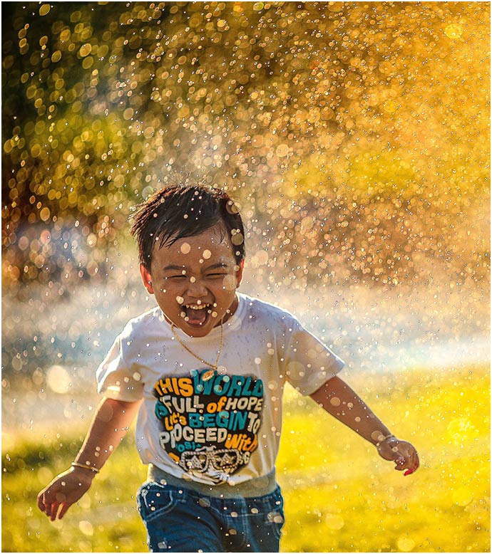 Boy in Water Spray
